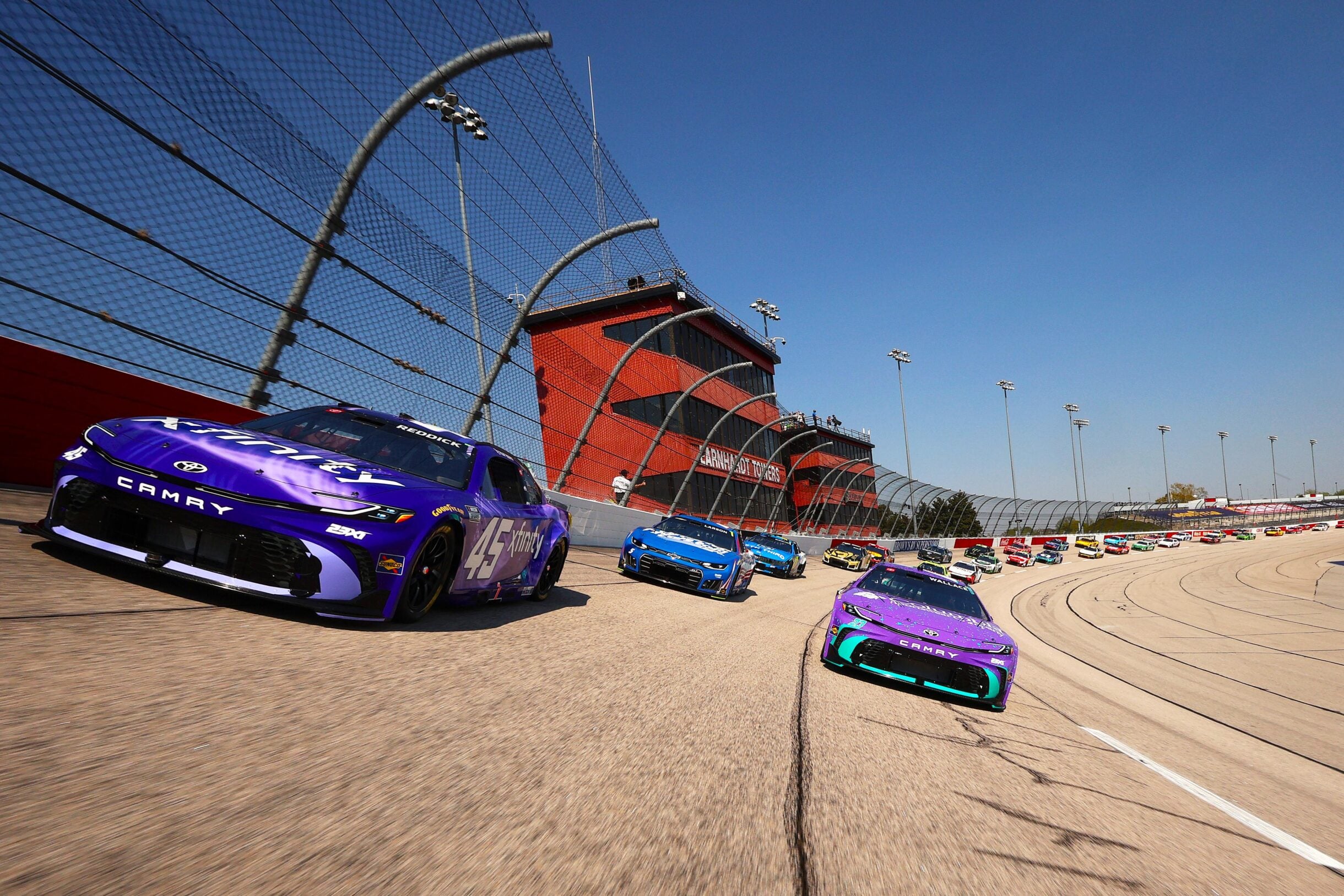 File photo: Tyler Reddick and Bubba Wallace at Darlington Raceway in March 2026. 23XI Racing is one of three Toyota teams powering the manufacturer's title run.