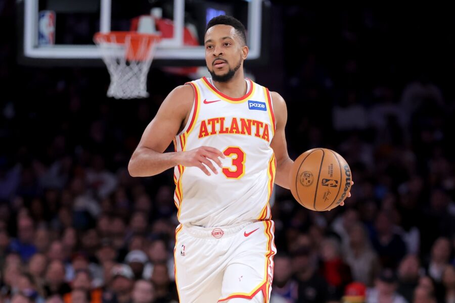 CJ McCollum handles the ball in his Atlanta Hawks white No. 3 jersey