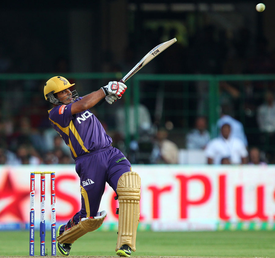 Cricket batter in action during a T20 match
