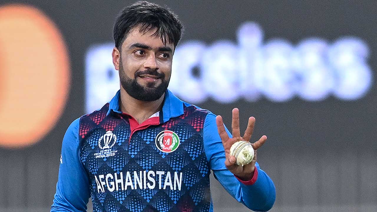 File photo, not from this match: Rashid Khan holding the ball in Afghanistan colours.