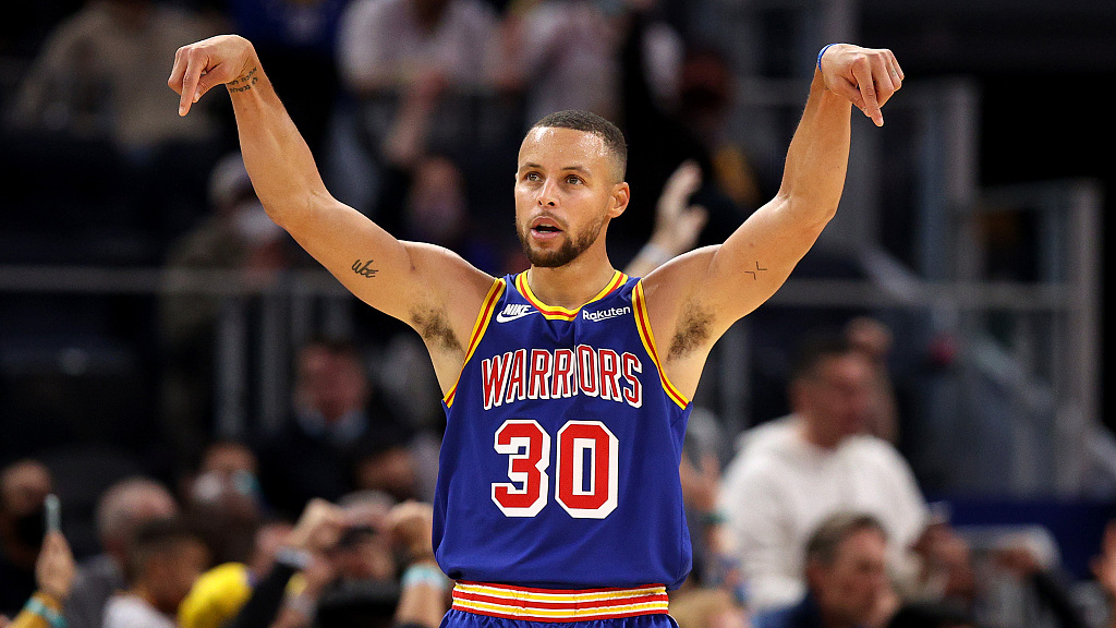 Archive photo, not from the Timberwolves game: Stephen Curry celebrating in a Golden State jersey.