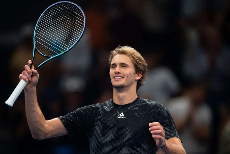 File photo, not from the Vienna match: Alexander Zverev smiling with his racket.