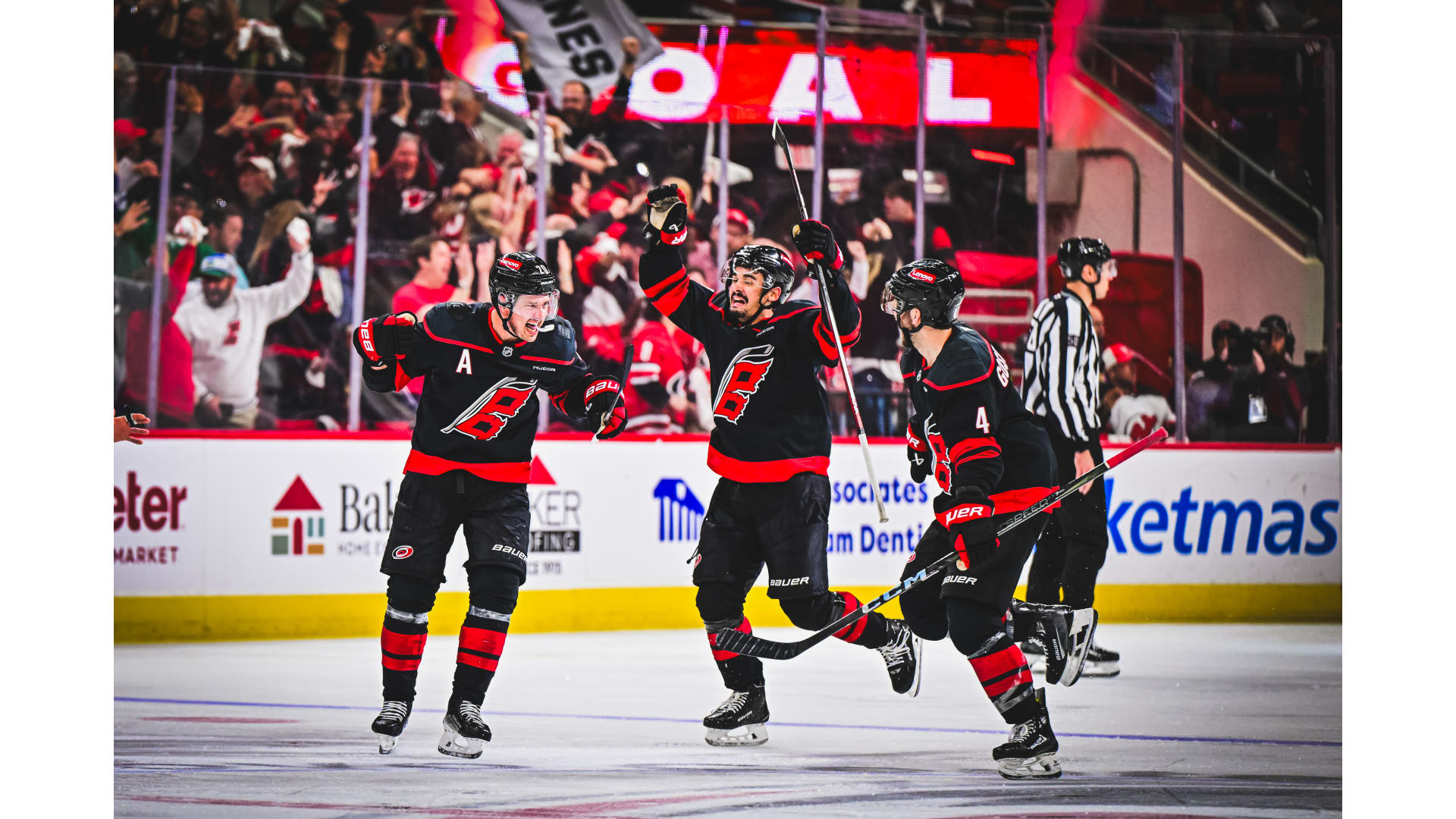 File photo, not from this game: Carolina Hurricanes players celebrating a goal.