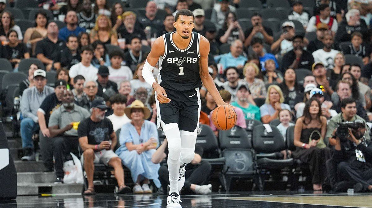File photo: Victor Wembanyama handles the ball for the Spurs; he opens the season as one of the league's MVP favorites.