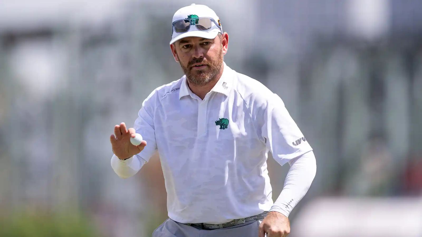 Louis Oosthuizen waves to the crowd at a 2026 LIV Golf event