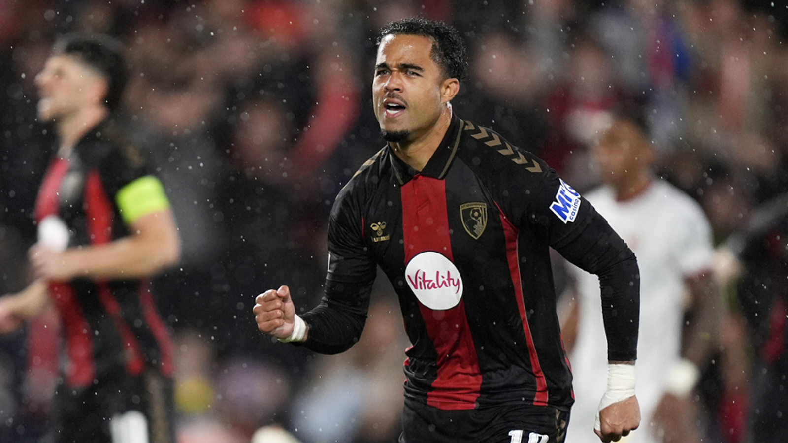 Justin Kluivert celebrates after giving Bournemouth the lead against AC Milan