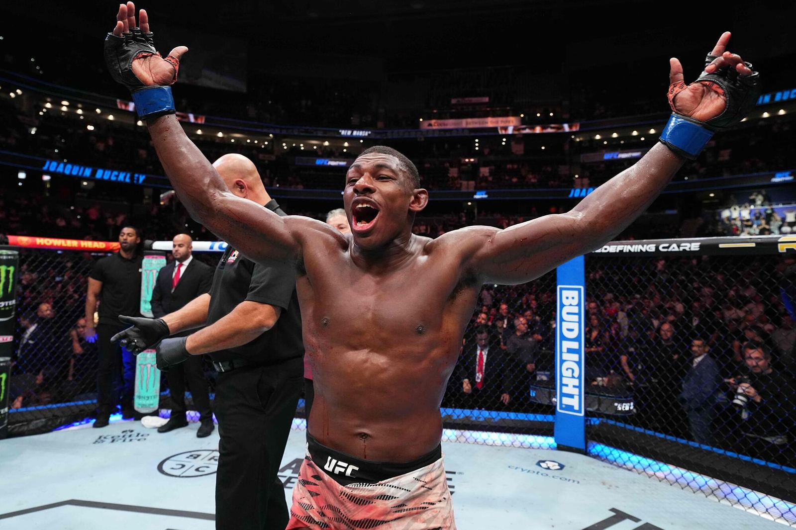 Joaquin Buckley celebrating with arms raised after his UFC Tampa win over Colby Covington