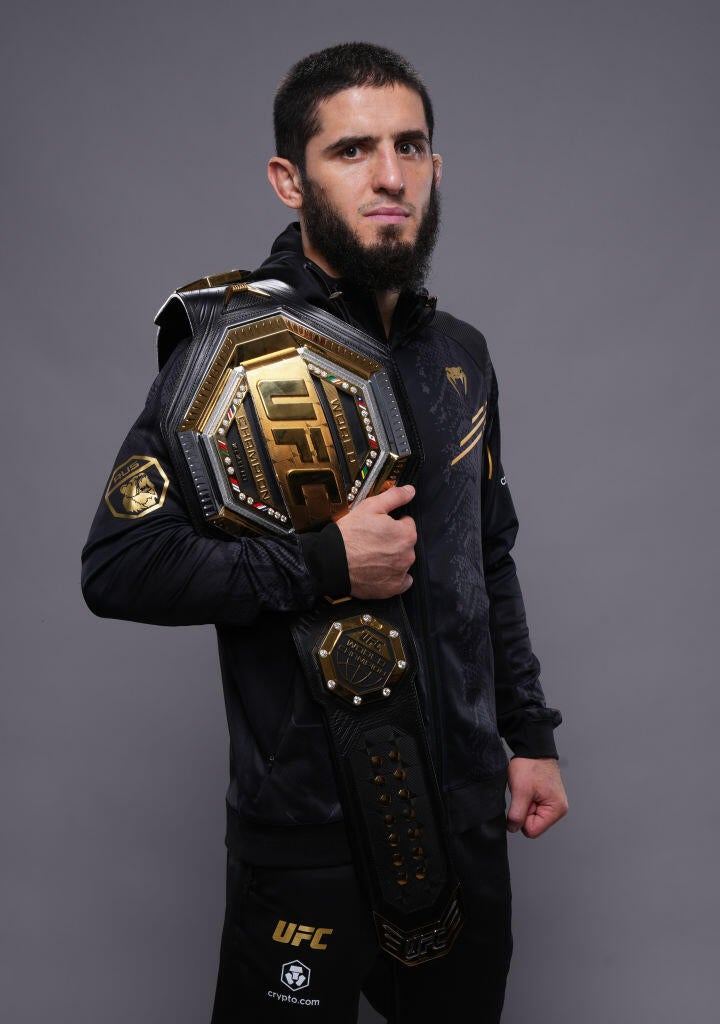 Islam Makhachev standing in the octagon, focused before a UFC bout