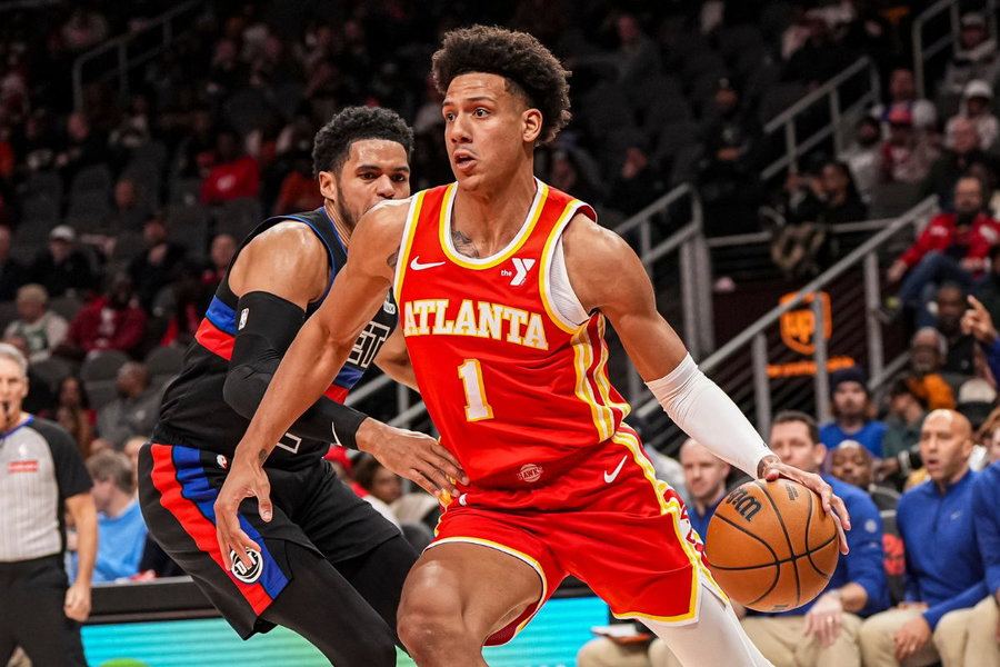 Jalen Johnson drives with the ball in his Atlanta Hawks red No. 1 jersey