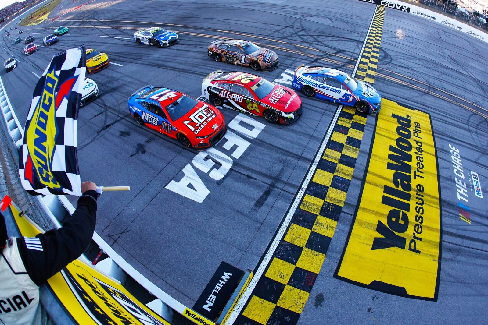 Kyle Larson takes the checkered flag to win the YellaWood 500 at Talladega