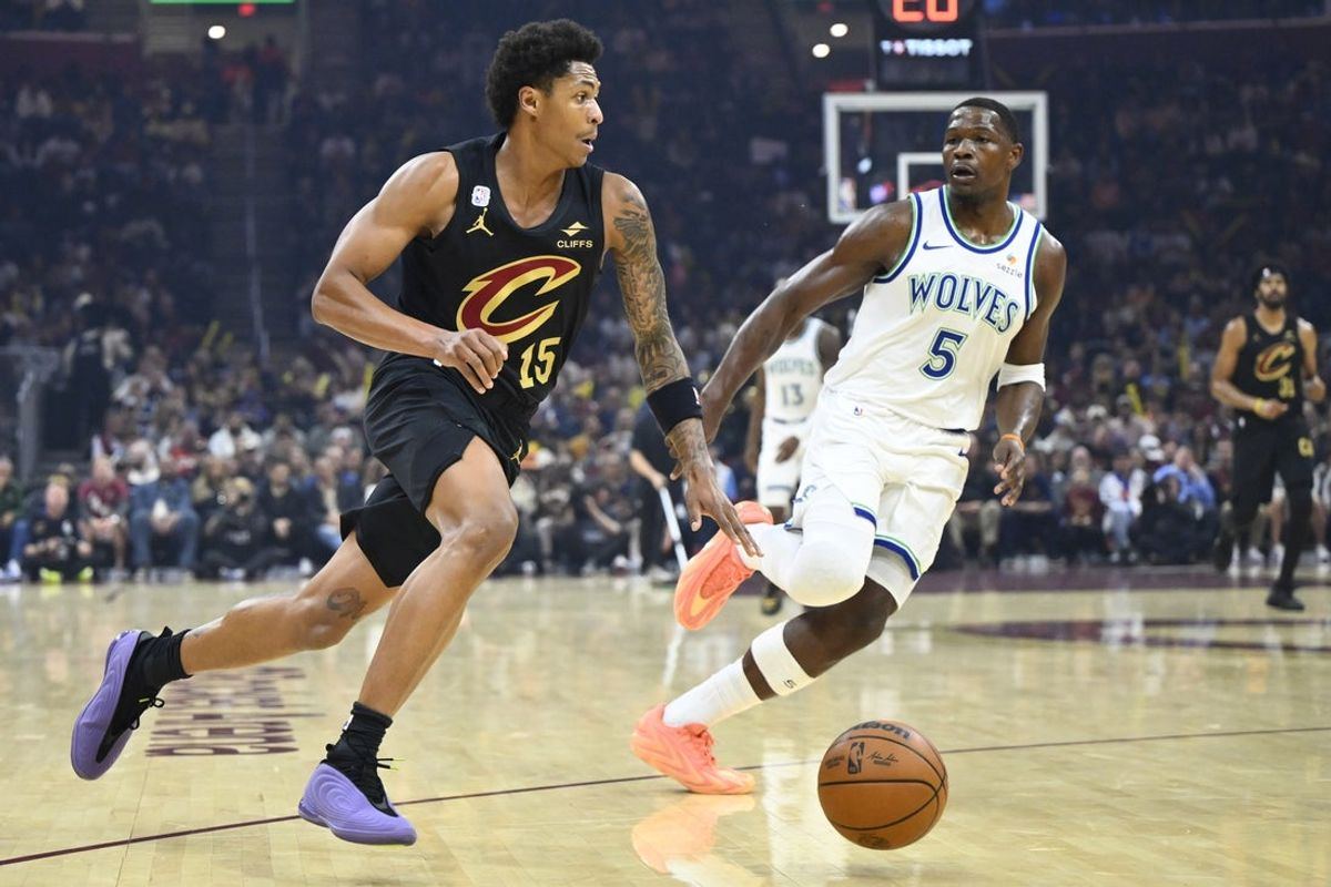Cleveland guard Meleek Thomas dribbles beside Minnesota guard Anthony Edwards in the first quarter at Rocket Arena on 26 October 2026