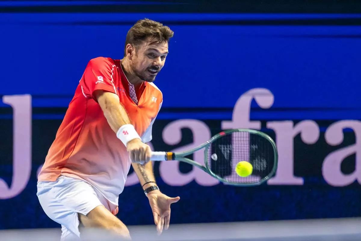 Stan Wawrinka returns a shot to Jiří Lehečka during the first round of the Swiss Indoors in Basel, Switzerland, on Tuesday, Oct. 27, 2026 (Georgios Kefalas/Keystone via AP).