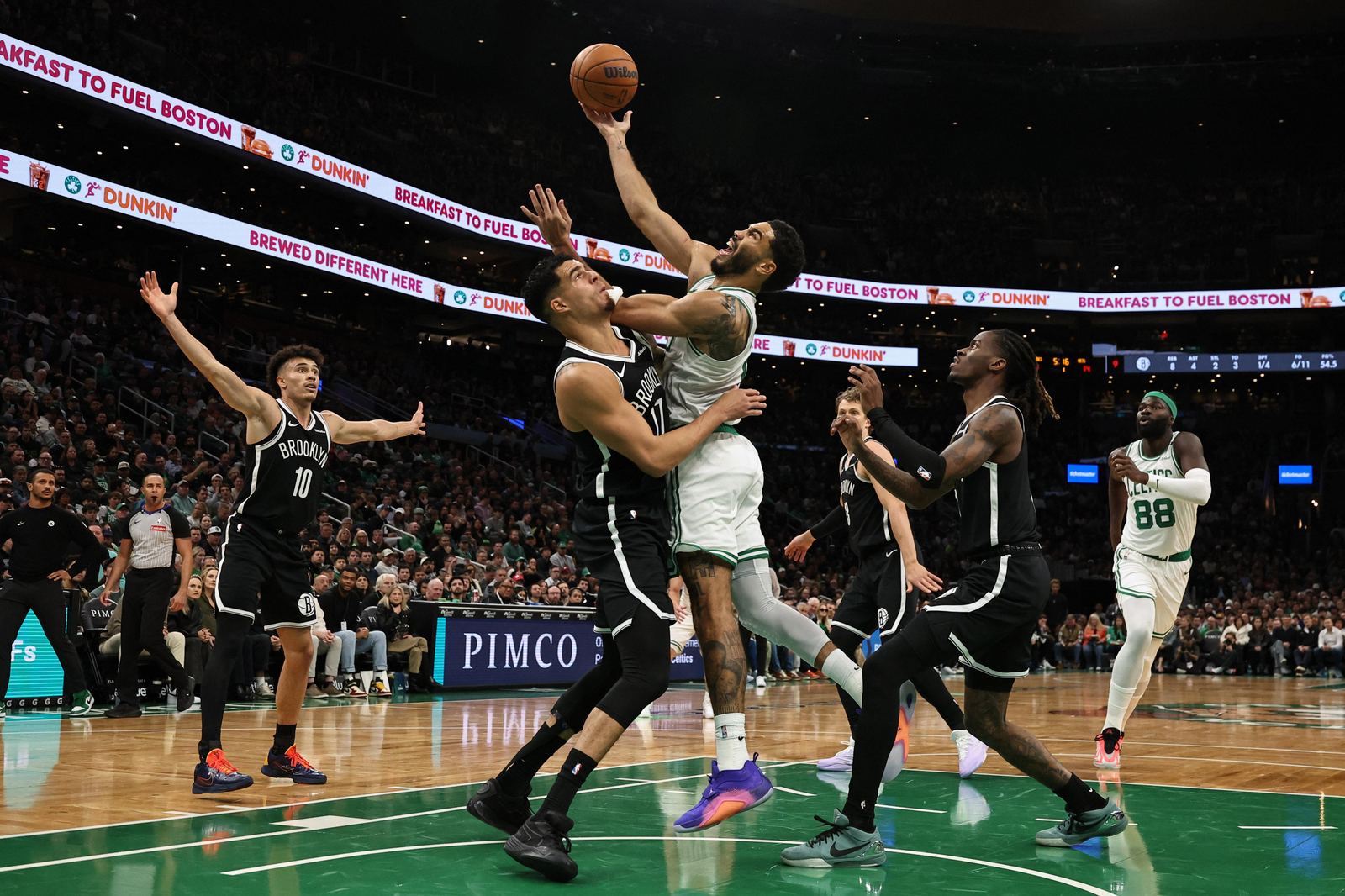 Boston Celtics forward Jayson Tatum shoots over Brooklyn Nets forward Michael Porter Jr. during the first quarter at TD Garden on 27 October 2026.