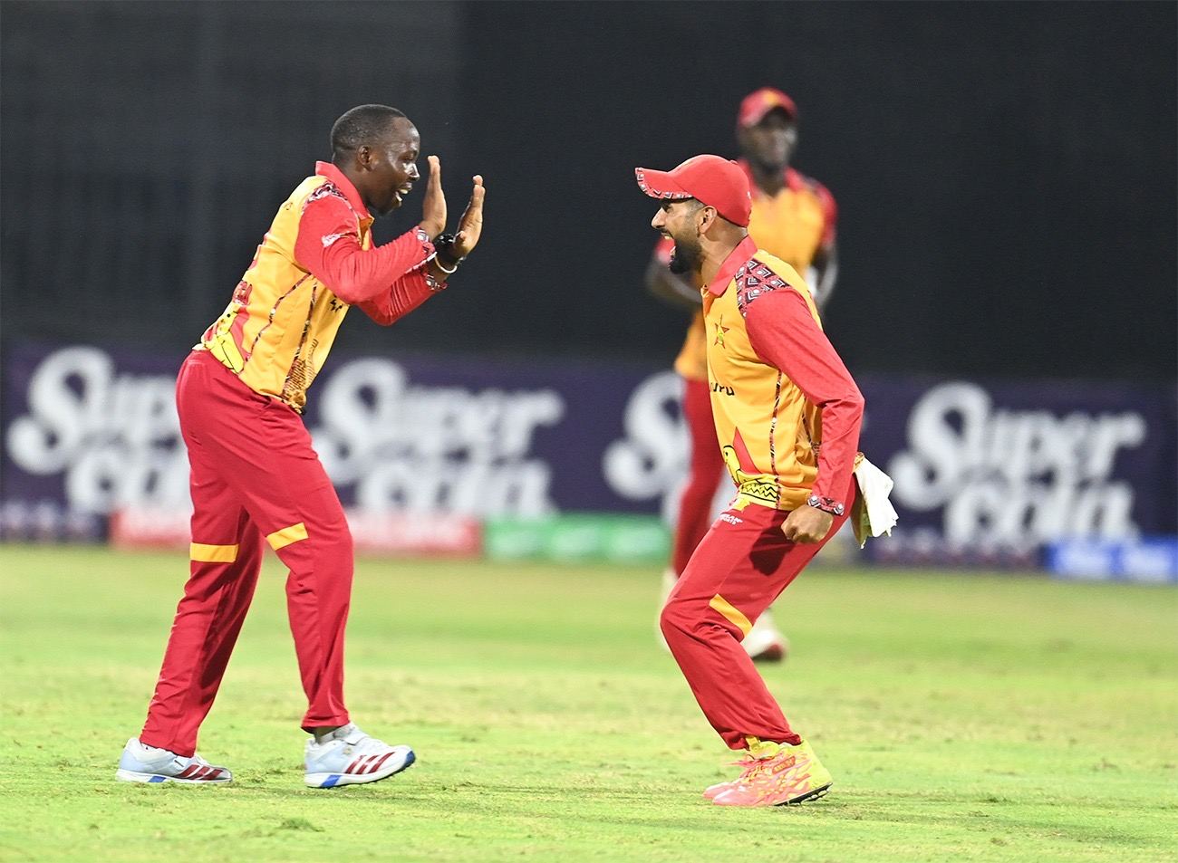 Vincent Masekesa celebrates his maiden international wicket with Zimbabwe captain Sikandar Raza during the second T20I against Afghanistan at Sharjah on 29 October 2026.
