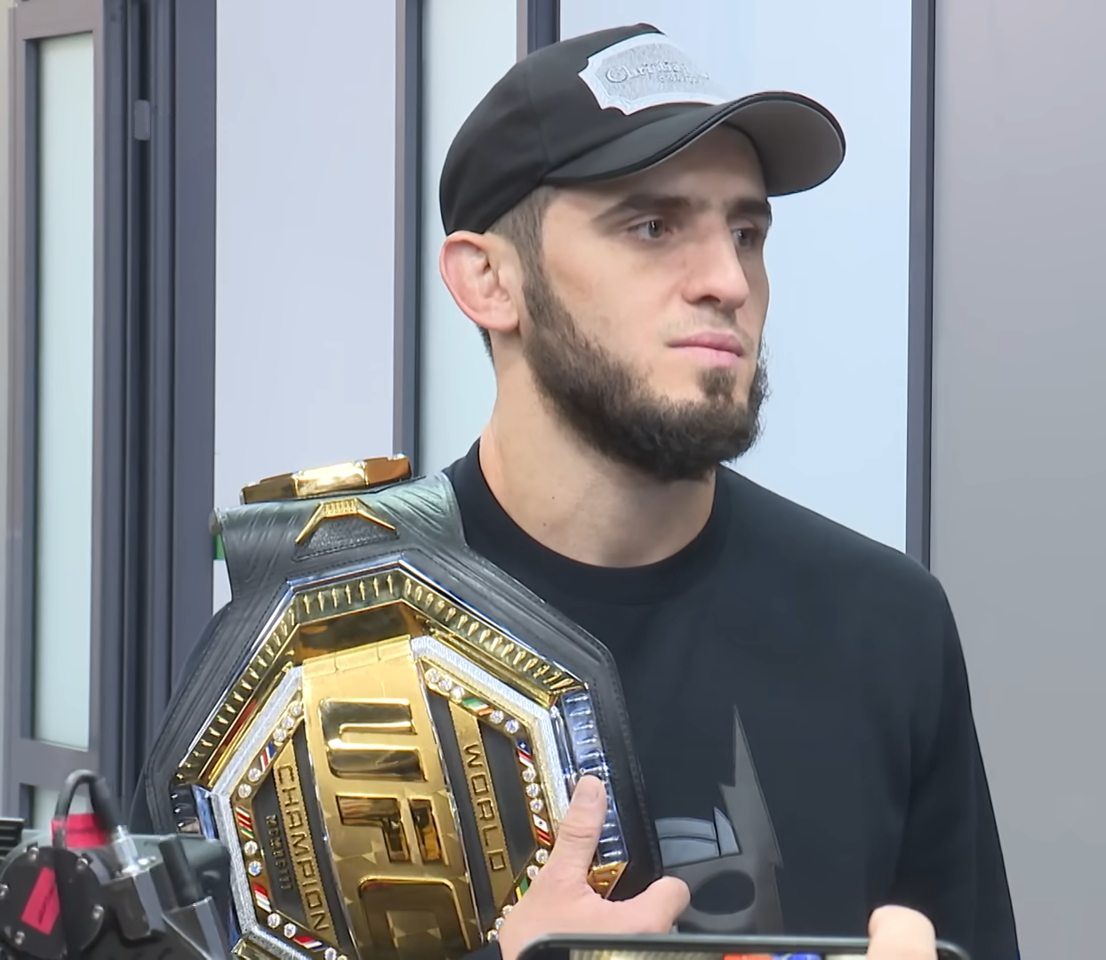 File photo: Islam Makhachev holding a UFC belt in 2022, not from UFC 330 or UFC 336.